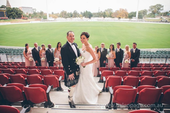 Bride and Groom at Adelaide Oval on the granndstad after wedding